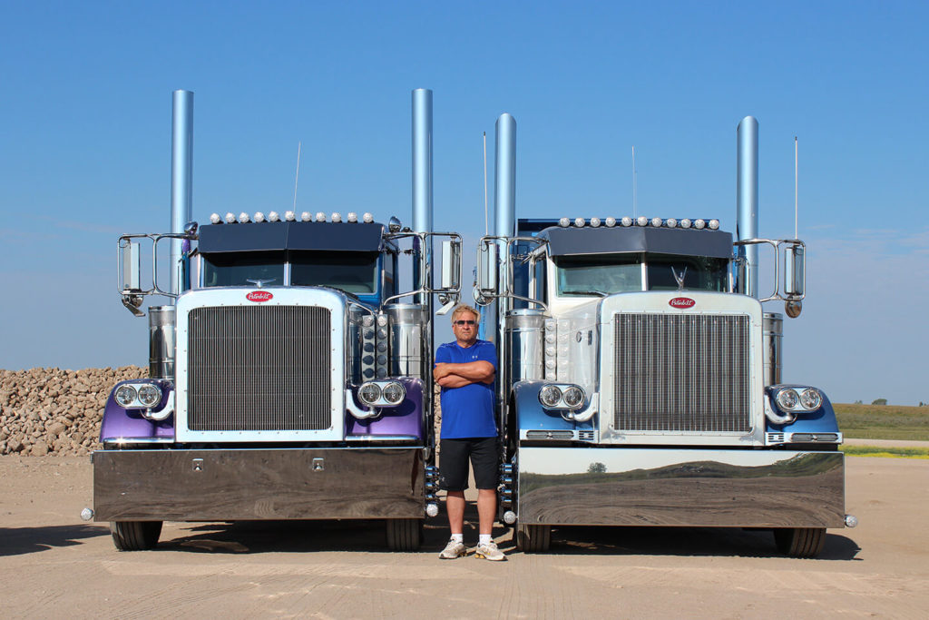 Lorne Pictured with Two Custom Peterbilt Daycabs