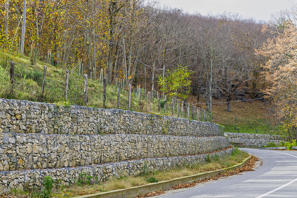 Retaining wall built with gabions filled with gabion stones.