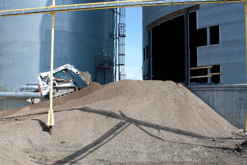 Skid steer building a gravel ramp atFWS site.