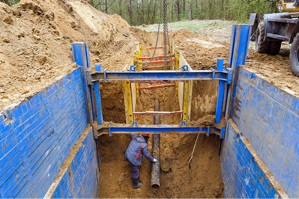 Shoring prevents trench collapse.