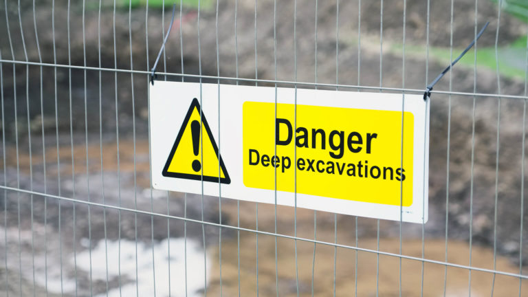 Excavation safety / warning sign.
