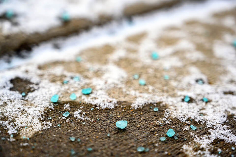 Salt melting snow off concrete