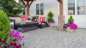 Small paved patio with furniture.