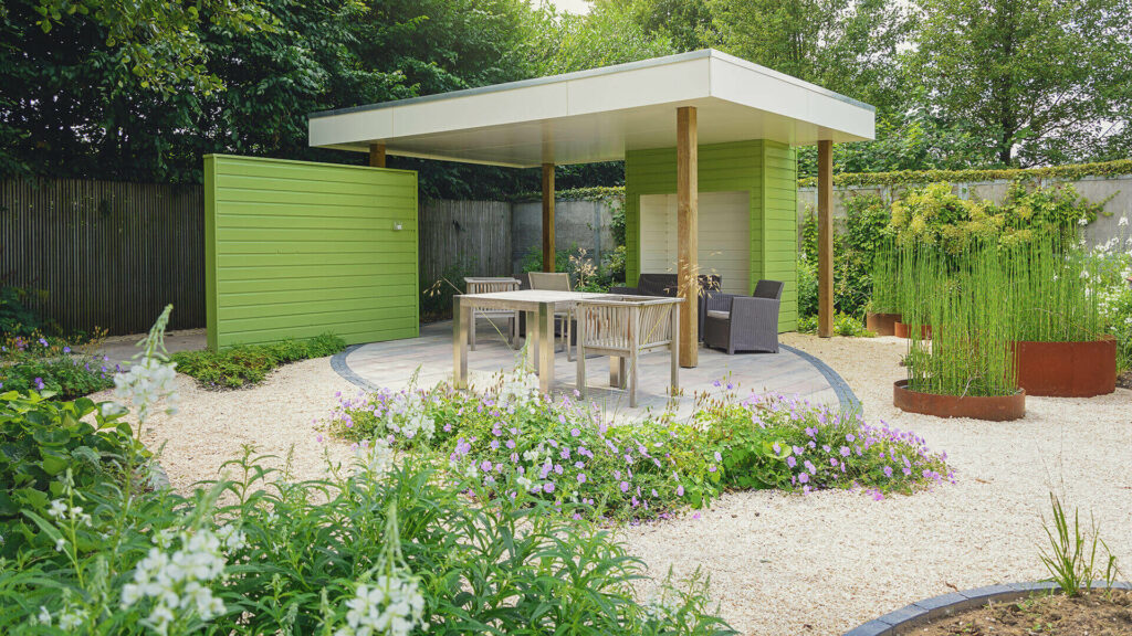 Colourful backyard incorporating gravel in the design.