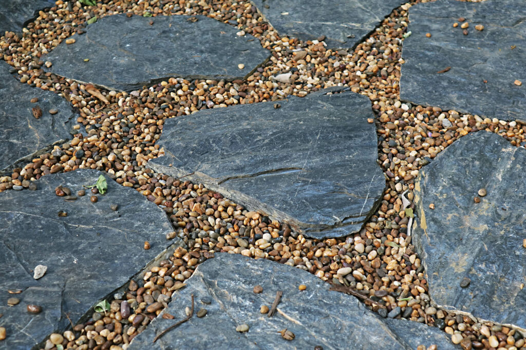 Stepping stones placed between gravel.
