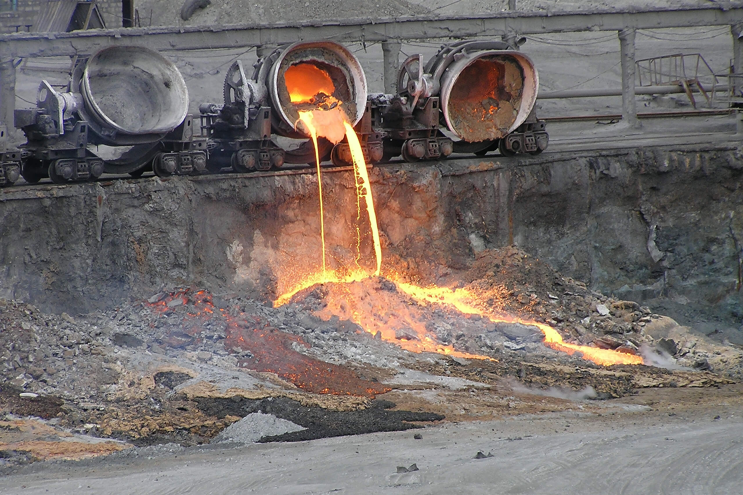 Molten slag is poured out and allowed to cool and solidify.